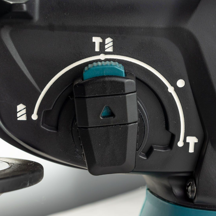 A teal and black Makita cordless combi drill with an 18V motor, a 13mm keyless chuck, and hammer, drill, and screwdriver modes.