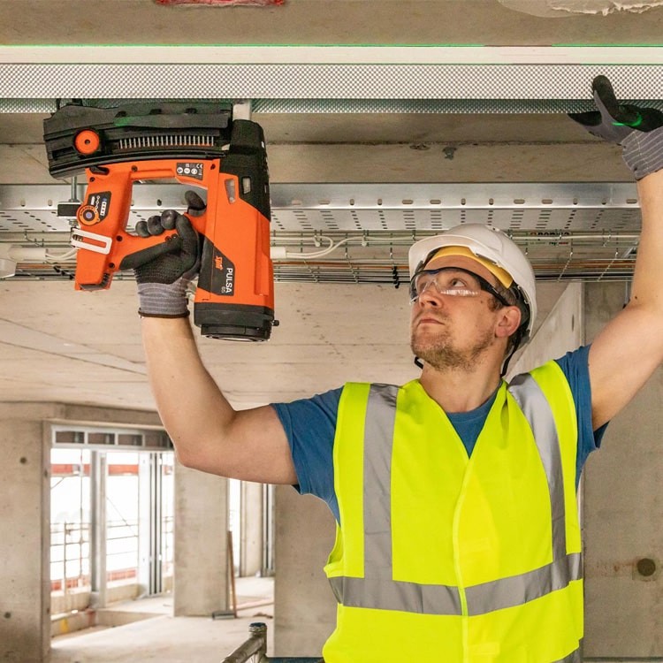 Spit Pulsa 65 Gas Nailer In Use on Site