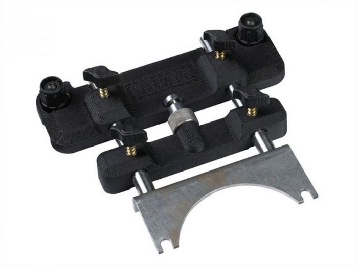A yellow and black DEWALT plunge router with a fine depth adjuster and a guide fence, for cutting grooves, rebates, and profiles in timber.