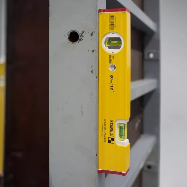 A Stabila 200cm spirit level with an extruded aluminium body and accurate vials, for checking horizontal and vertical alignment.