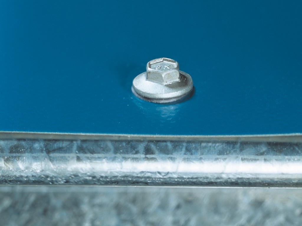 A steel self-drilling screw with a sharp drill-point tip and spiral threads along the shaft, suitable for fixing into steel framing.