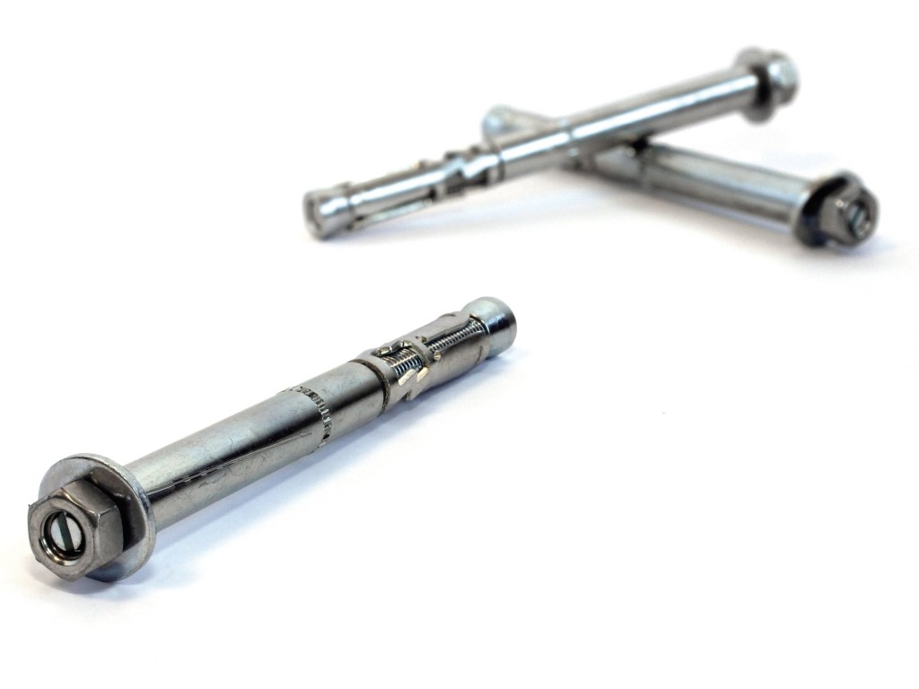 A metal 15×114mm high-performance torque-controlled expansion anchor with a hex nut, designed for heavy-duty structural fixing into concrete.