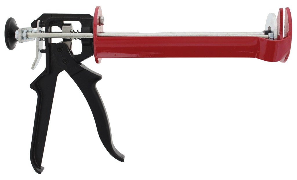 An orange and black Spit cordless power tool, with an ergonomic grip, designed for use on construction and maintenance tasks.