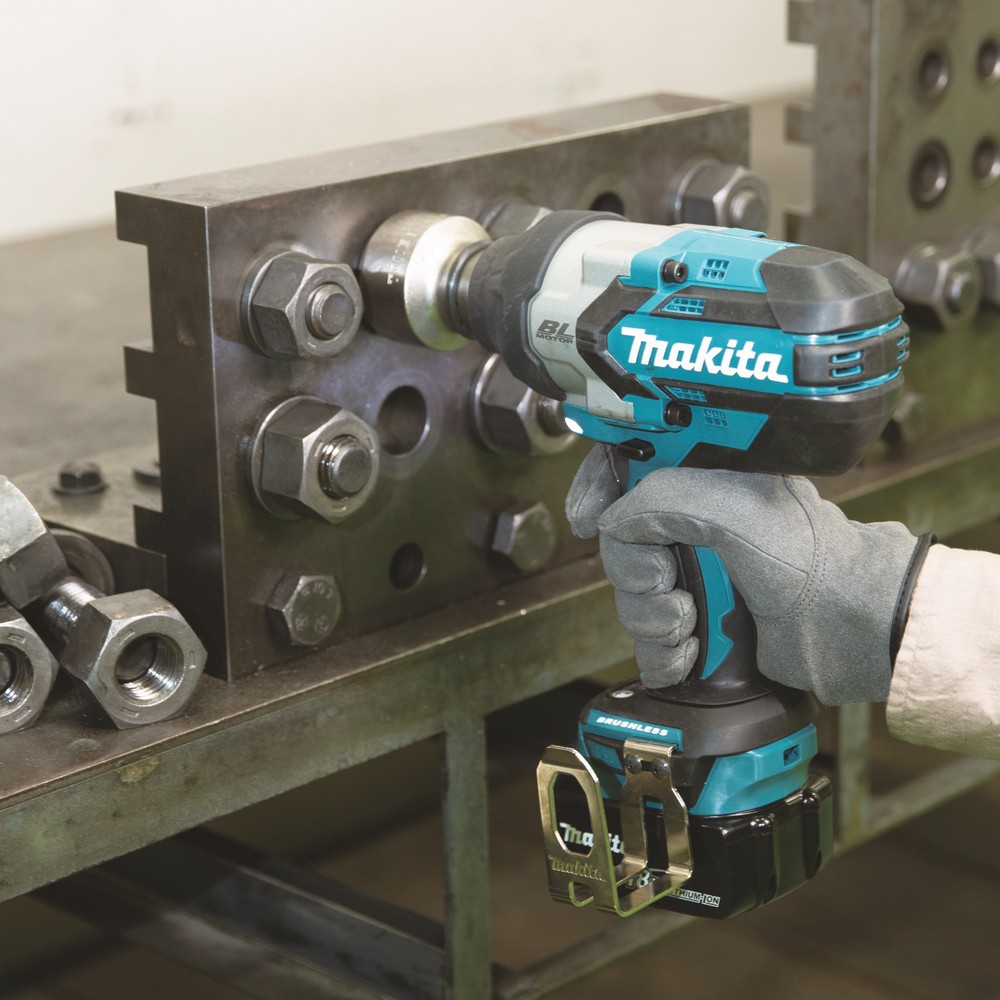 A teal and black Makita cordless impact driver with a 18V motor, a hex-chuck, and variable speed, for high-torque screw driving and fastening.