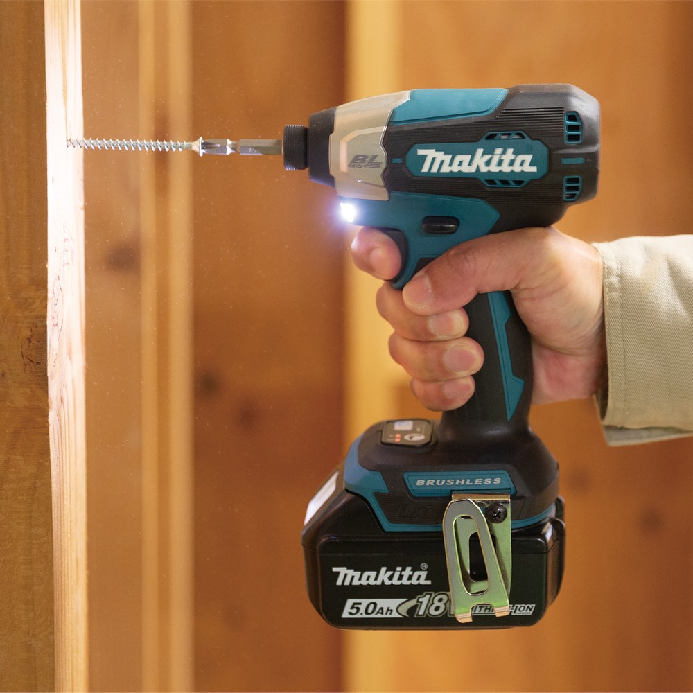 A teal and black Makita cordless impact driver with a 18V motor, a hex-chuck, and variable speed, for high-torque screw driving and fastening.