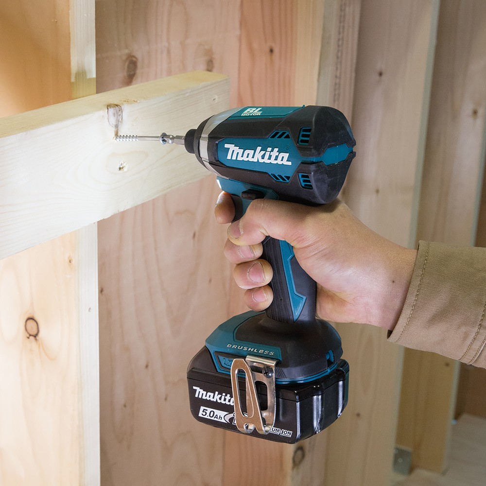 A teal and black Makita cordless combi drill with an 18V motor, a 13mm keyless chuck, and hammer, drill, and screwdriver modes.