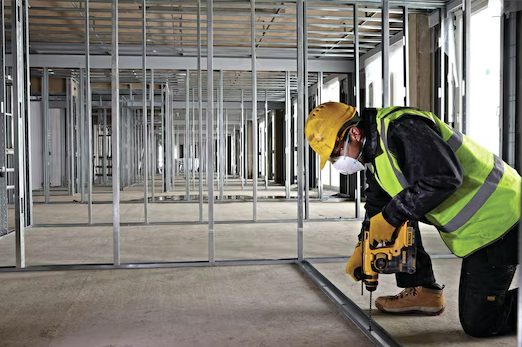 A yellow and black DEWALT cordless SDS-Plus rotary hammer drill with 18V hammer, rotation, and chisel modes, for drilling and chiselling into concrete and masonry.