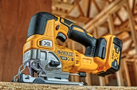 A yellow and black DEWALT cordless jigsaw with 18V orbital action and a variable-speed trigger, for cutting curves and internal shapes.