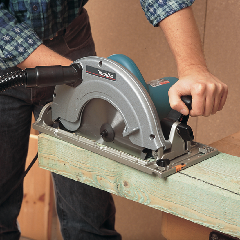 A teal and black Makita corded circular saw with a 110V motor, an adjustable bevel plate, and a blade guard, for ripping and cross-cutting timber.
