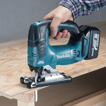 A teal and black Makita cordless jigsaw with 18V orbital action and a variable-speed trigger, for cutting curves and internal shapes.
