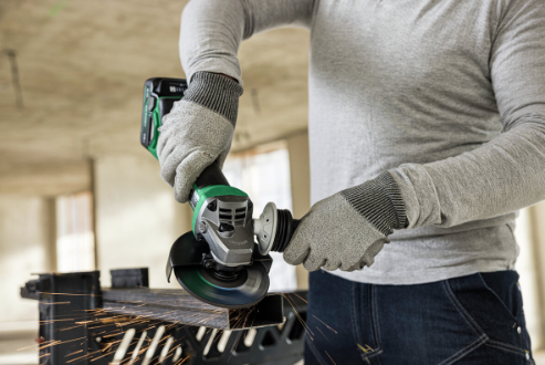 A green and black HiKOKI cordless angle grinder with a 18V motor, a side handle, and a wheel guard, for grinding, cutting, and surface preparation.