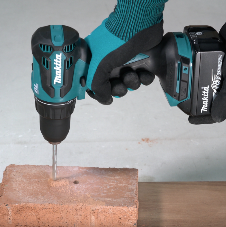 A teal and black Makita cordless combi drill with an 18V motor, a 13mm keyless chuck, and hammer, drill, and screwdriver modes.