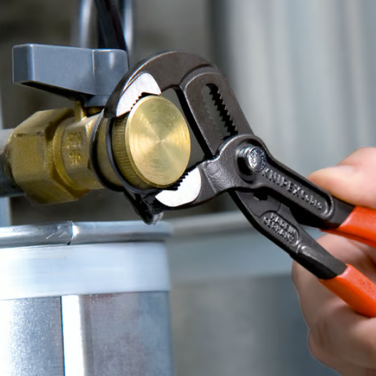 A pair of water-pump pliers with tongue-and-groove adjustable jaws for gripping pipes, nuts, and irregular shapes.