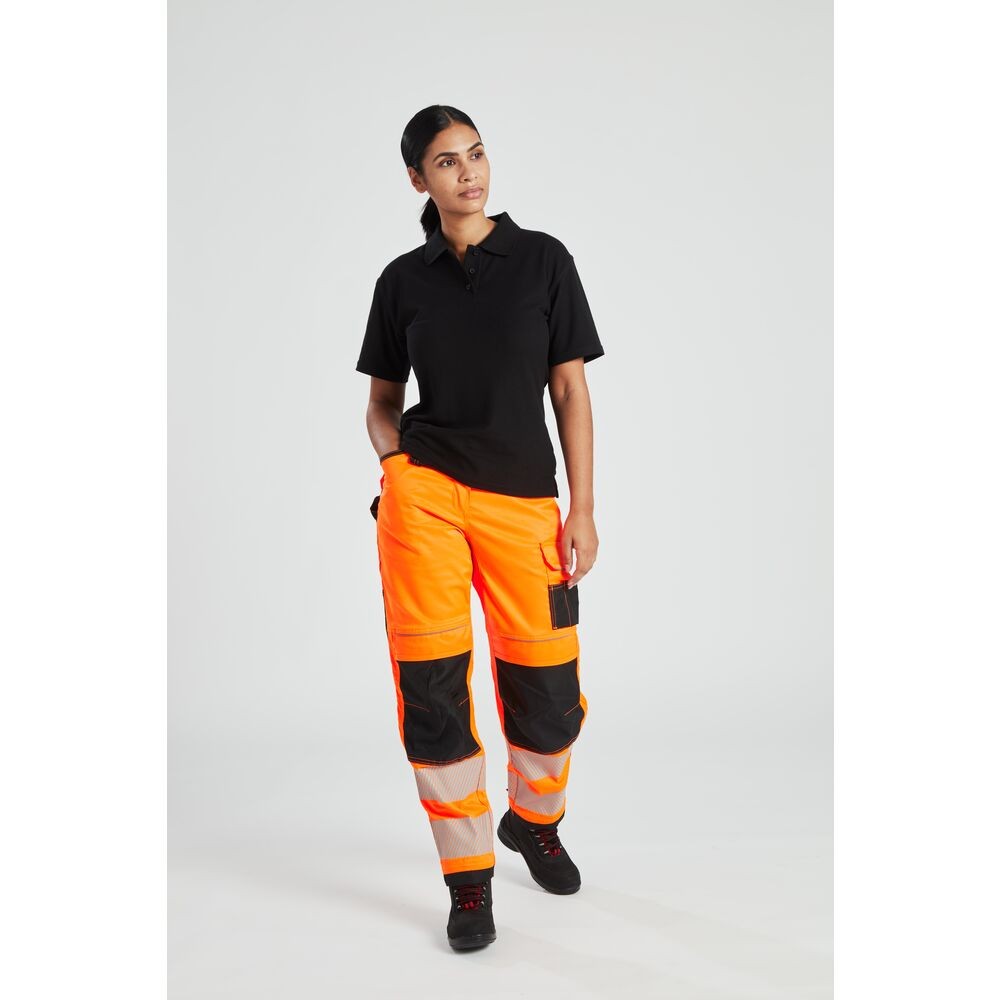 A women's black polo shirt designed for use on construction sites and in industrial work environments.,