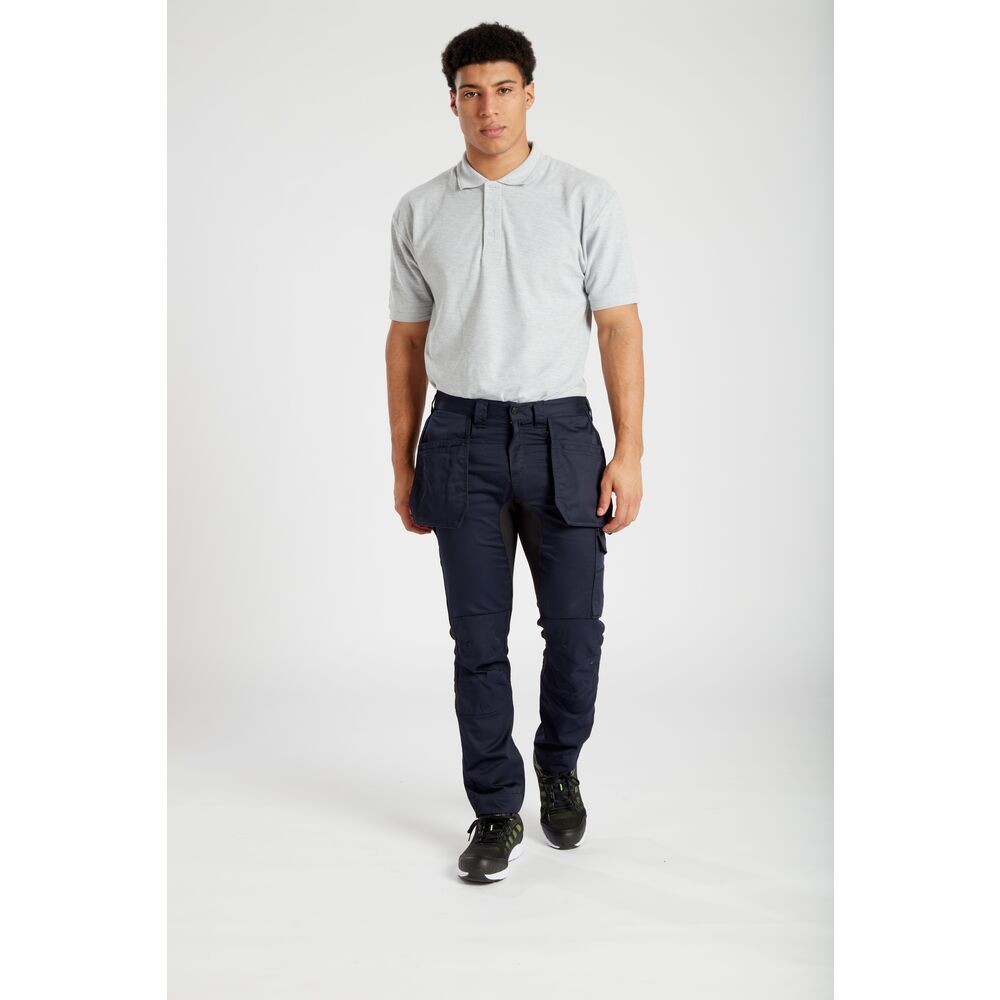 A white polo shirt designed for use on construction sites and in industrial work environments.,