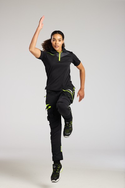 A women's black polo shirt designed for use on construction sites and in industrial work environments.,