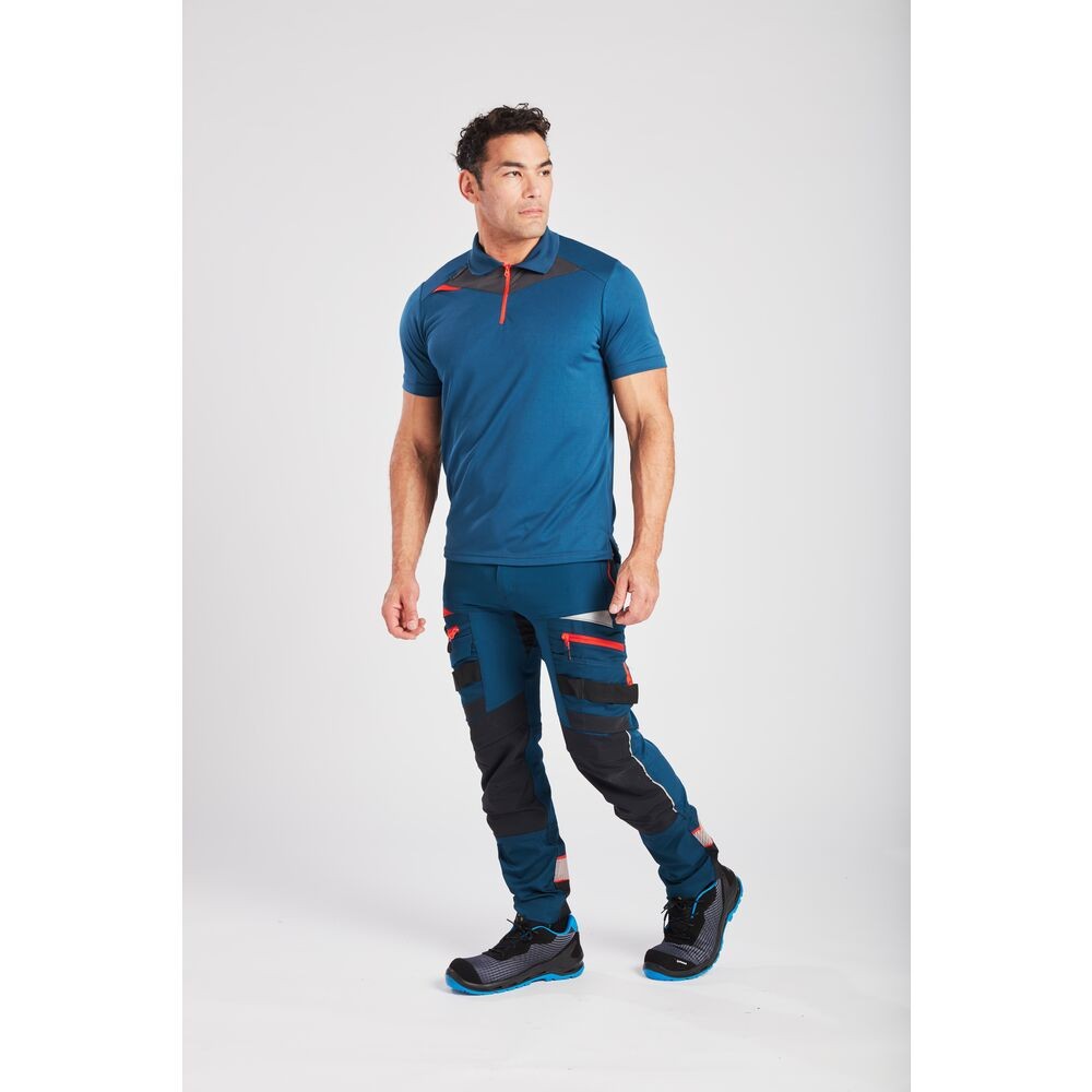 A blue polo shirt designed for use on construction sites and in industrial work environments.,