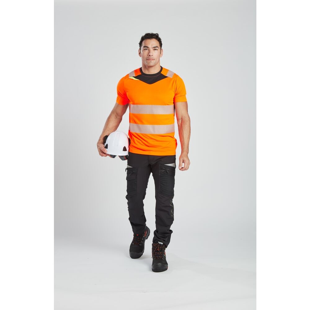 A high-visibility orange work shirt featuring retroreflective tape panels, suitable for a wide range of outdoor and site work applications.