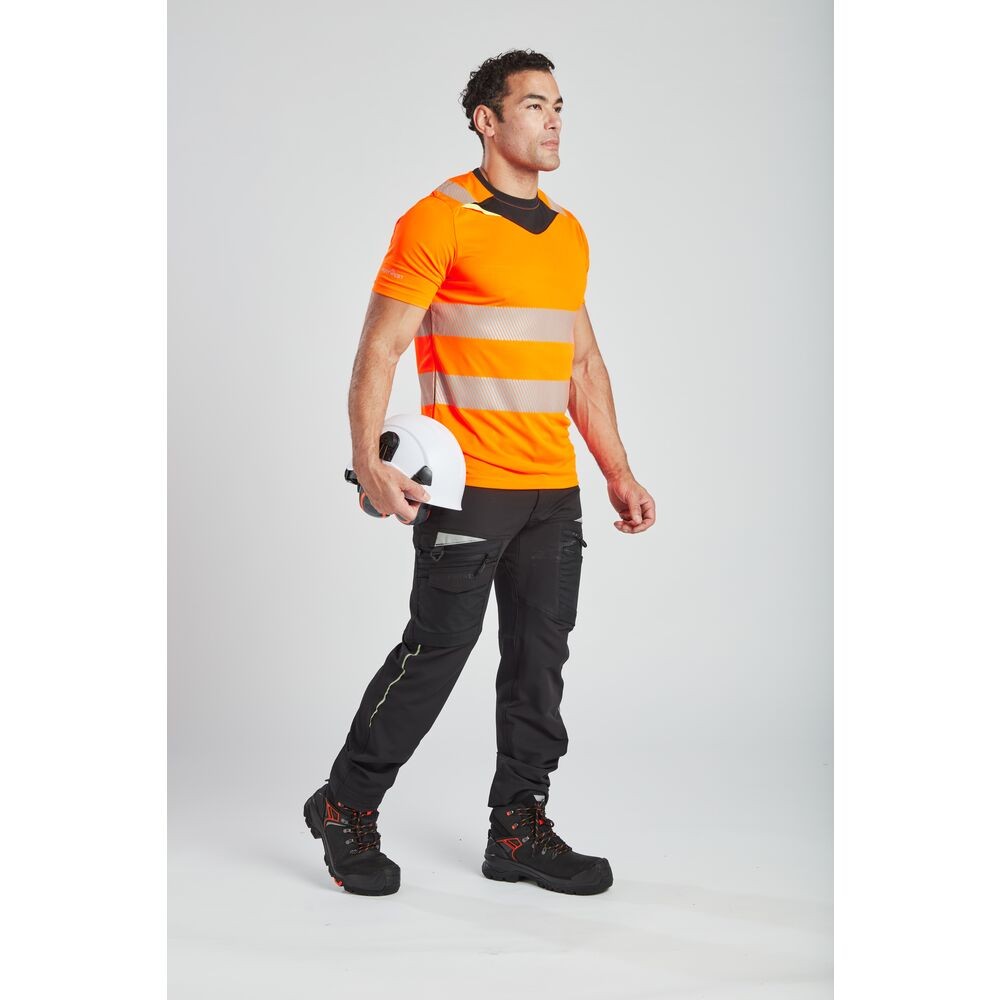 A high-visibility orange work shirt featuring retroreflective tape panels, suitable for a wide range of outdoor and site work applications.