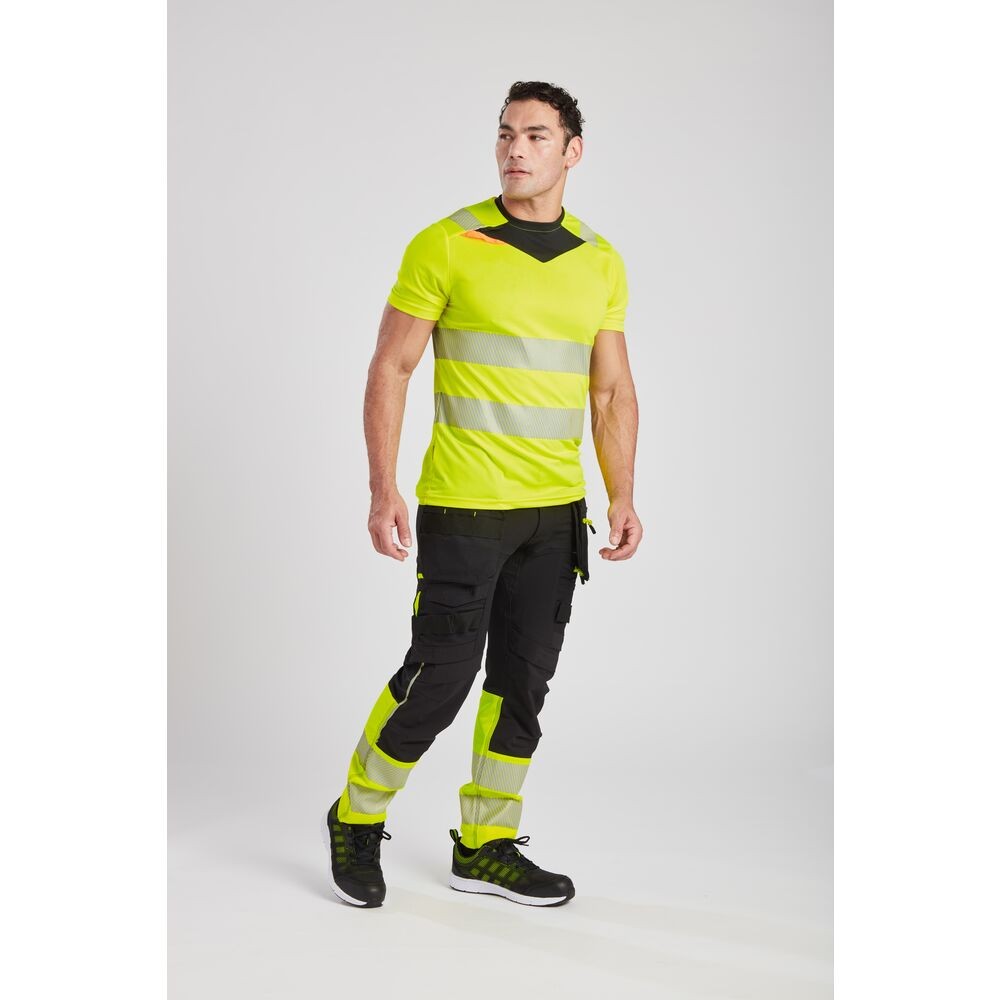 A high-visibility yellow work shirt featuring retroreflective tape panels, suitable for a wide range of outdoor and site work applications.