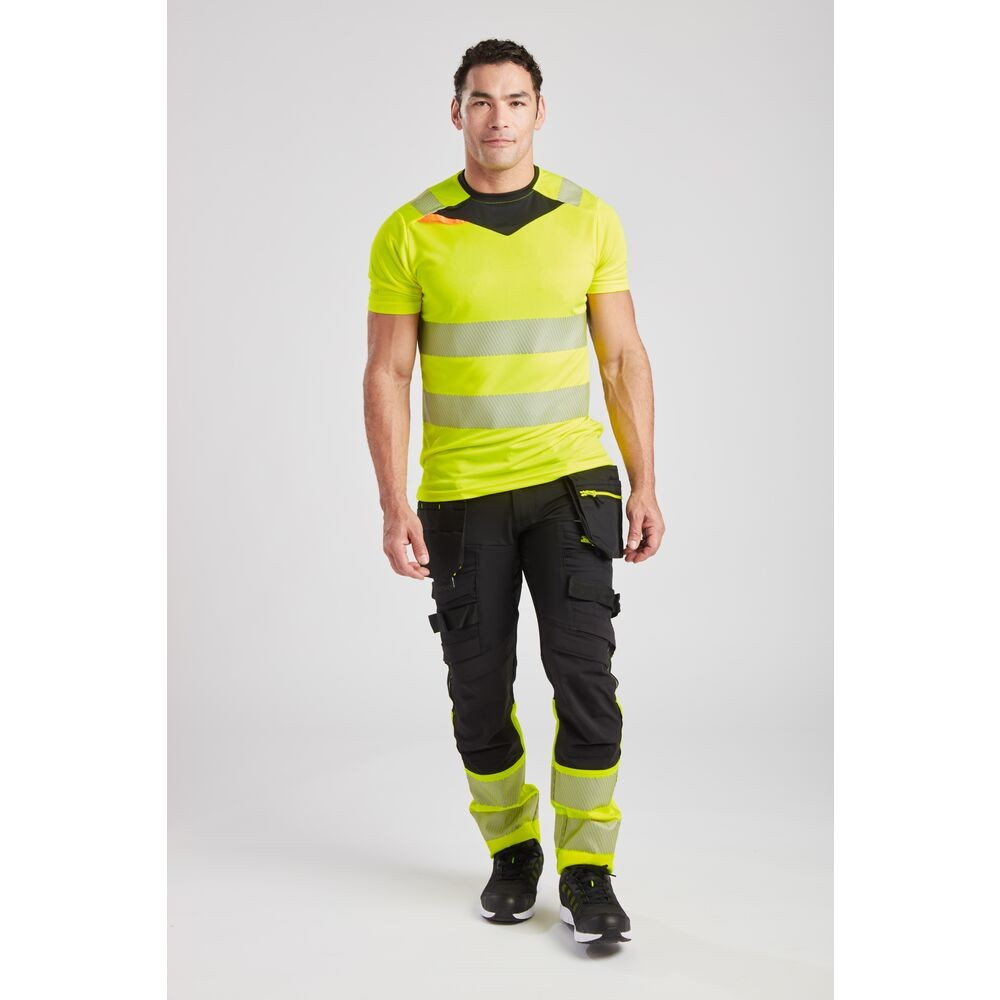 A high-visibility yellow work shirt featuring retroreflective tape panels, suitable for a wide range of outdoor and site work applications.