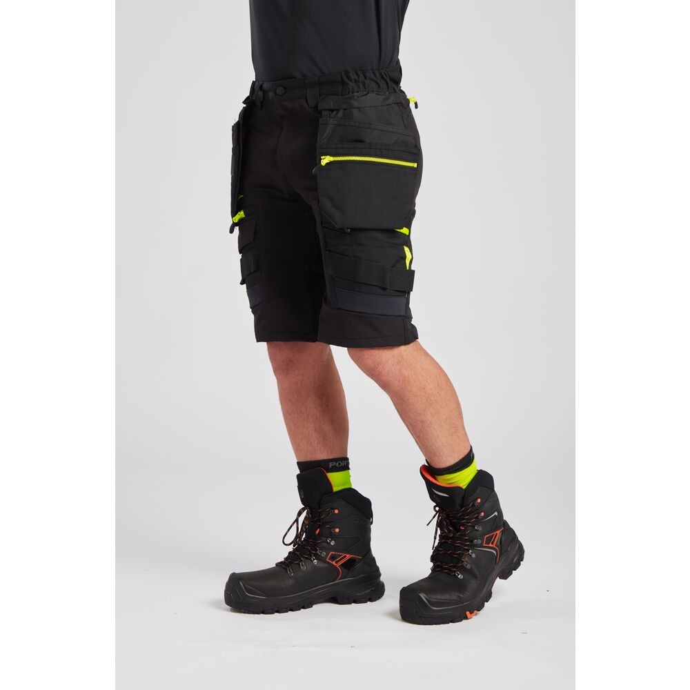 A black workwear garment featuring functional pockets, suitable for a wide range of outdoor and site work applications.