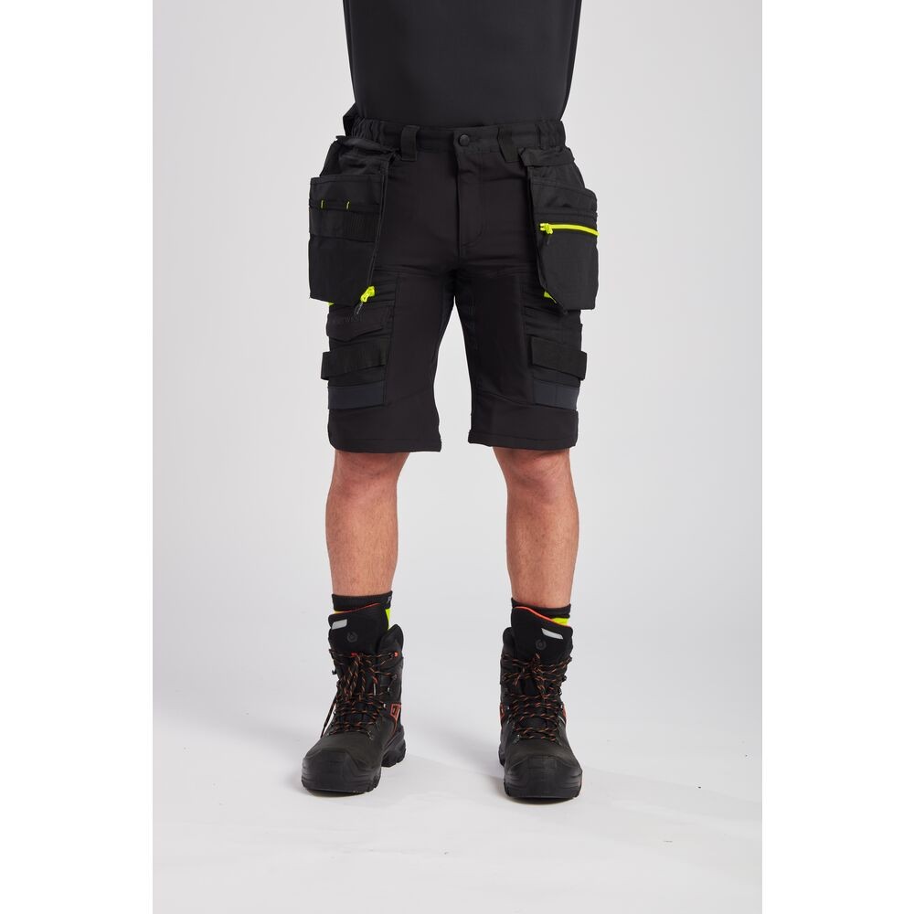 A black workwear garment featuring functional pockets, suitable for a wide range of outdoor and site work applications.