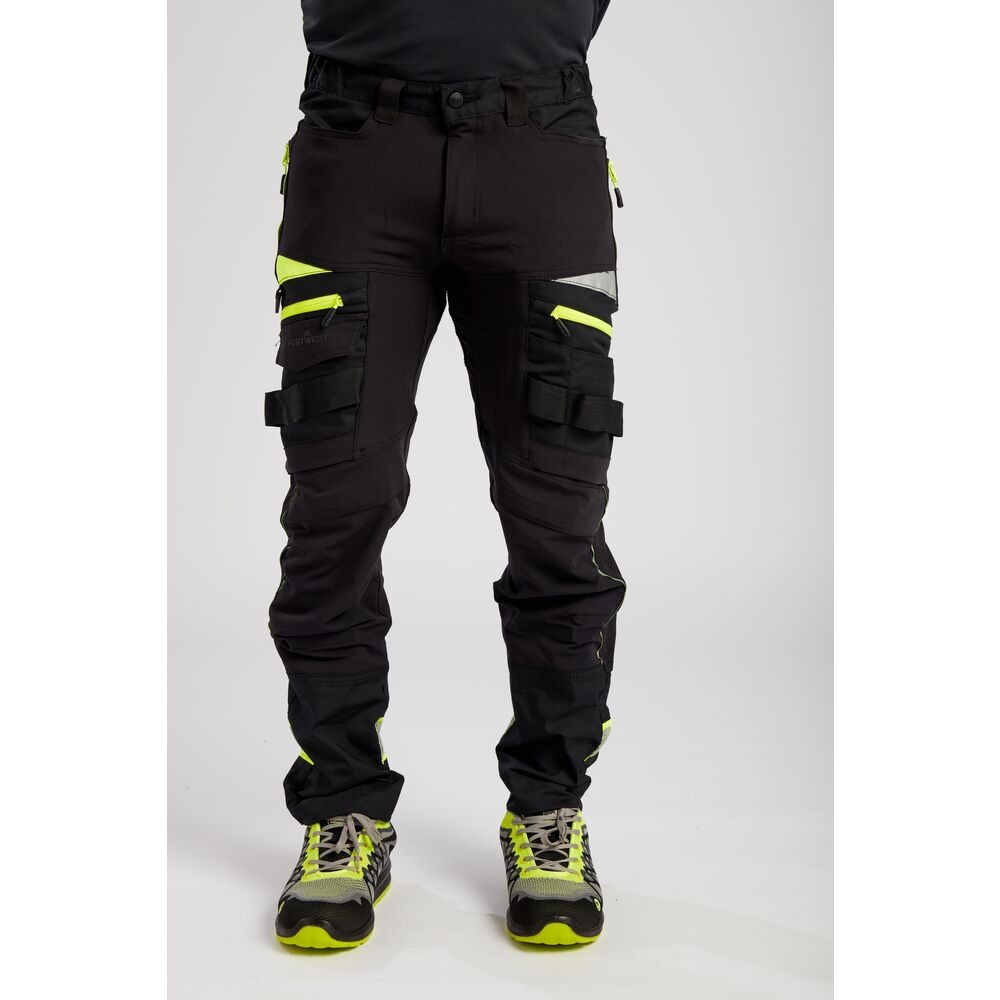 A pair of black work trousers designed for use on construction sites and in industrial work environments.,