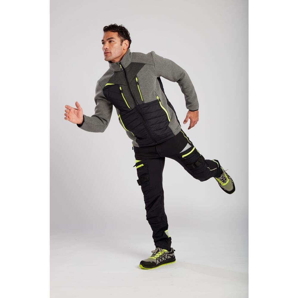 A pair of black work trousers designed for use on construction sites and in industrial work environments.,