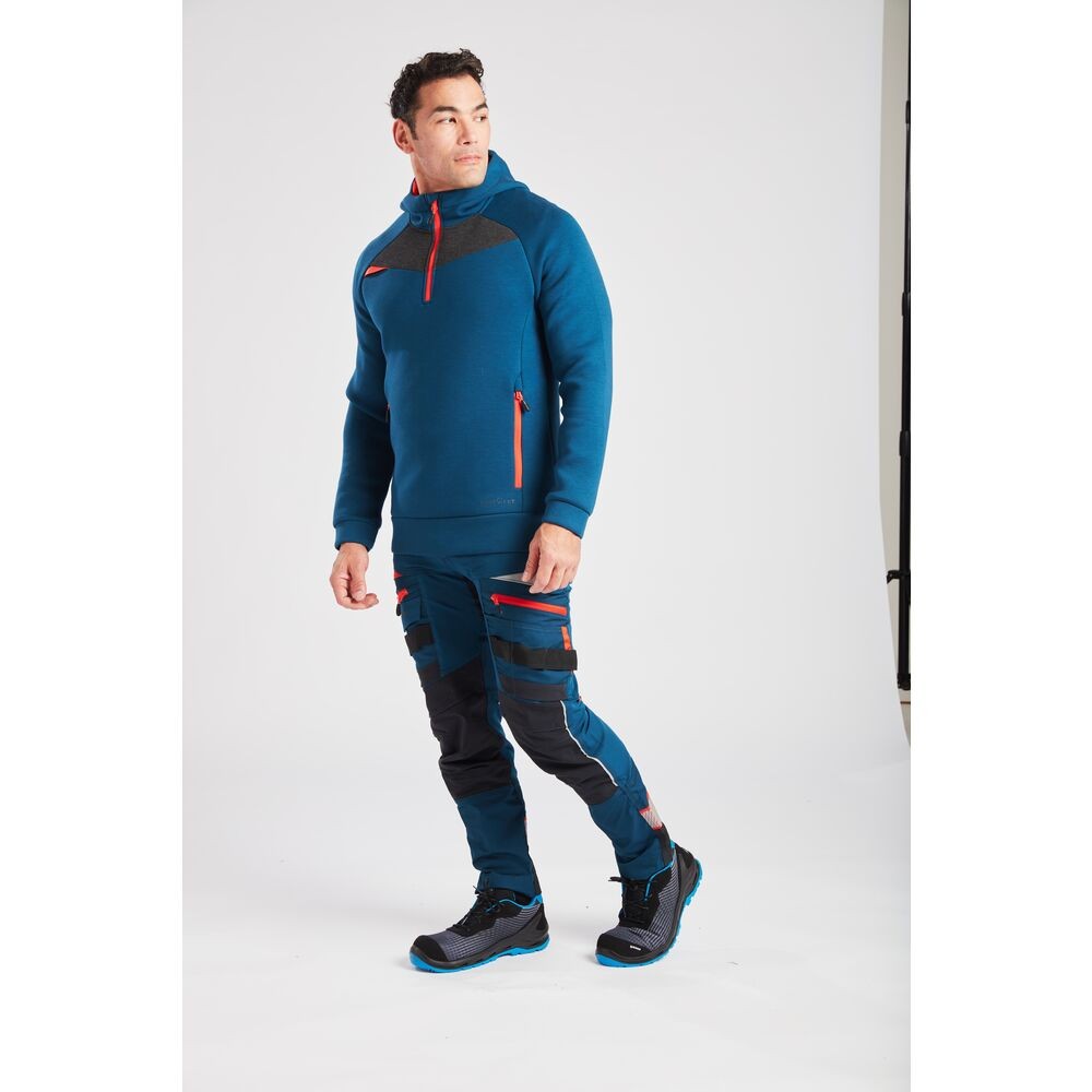 A pair of blue work trousers designed for use on construction sites and in industrial work environments.,