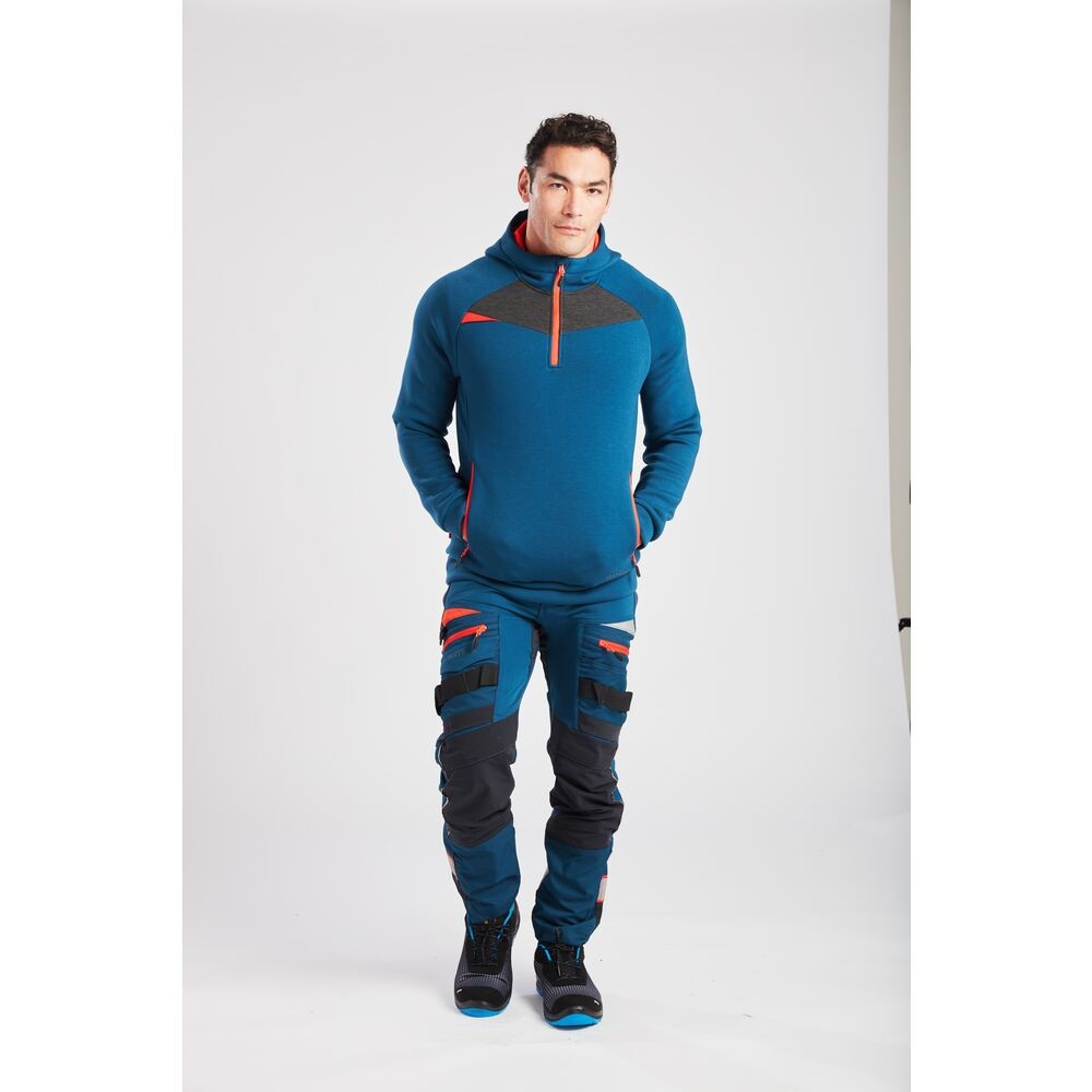 A pair of blue work trousers designed for use on construction sites and in industrial work environments.,