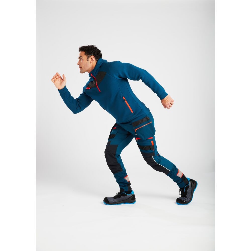 A pair of blue work trousers designed for use on construction sites and in industrial work environments.,