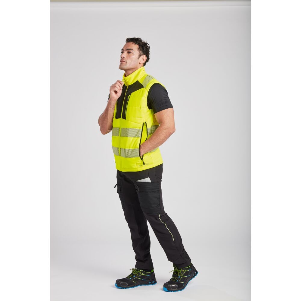 A high-visibility yellow workwear garment featuring retroreflective tape panels, suitable for a wide range of outdoor and site work applications.