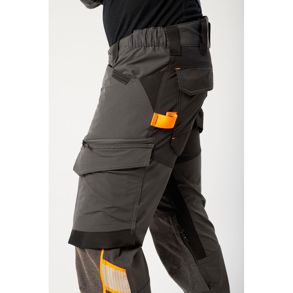 A pair of grey work trousers featuring stretch panels for ease of movement, suitable for a wide range of outdoor and site work applications.