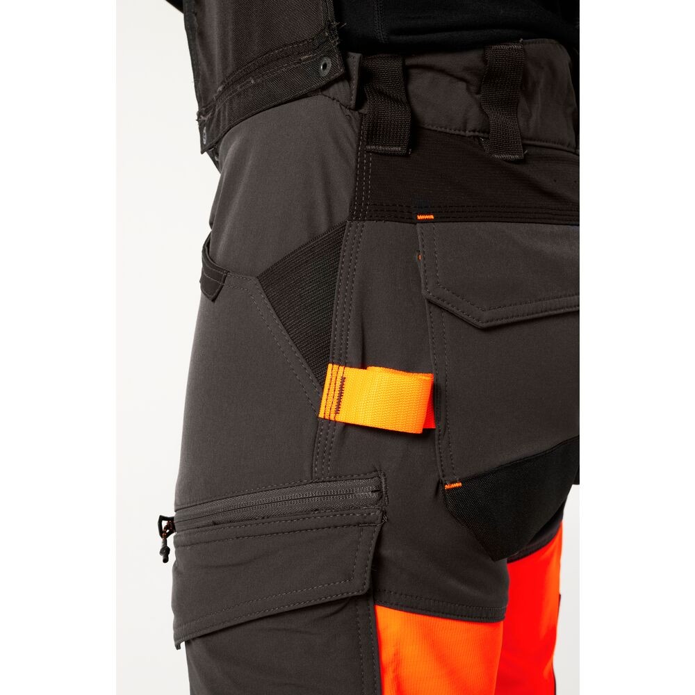 A pair of high-visibility orange trousers featuring retroreflective tape panels, stretch panels for ease of movement, suitable for a wide range of outdoor and site work applications.