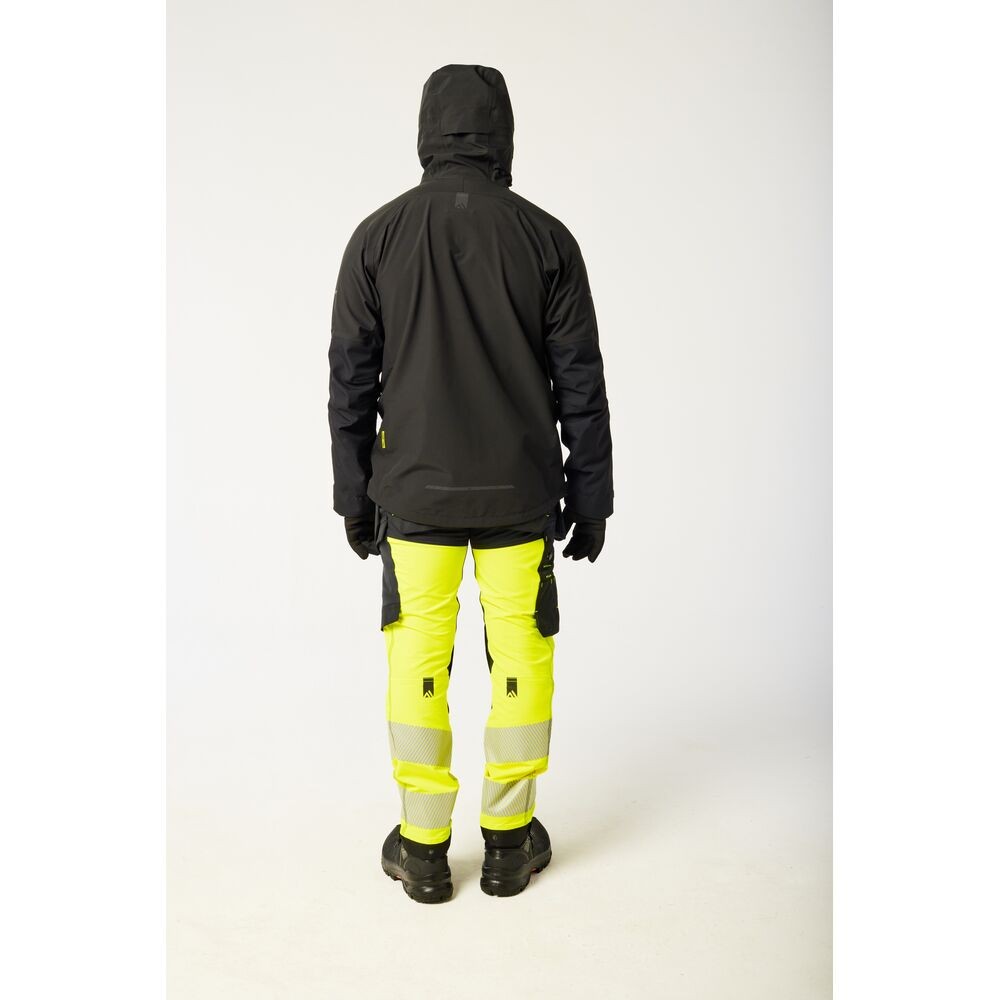 A black jacket designed for use on construction sites and in industrial work environments.,