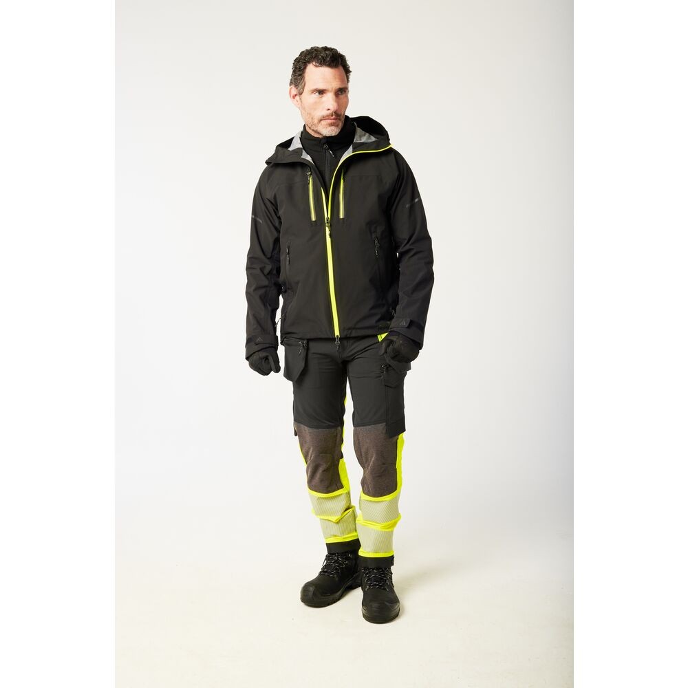 A black jacket designed for use on construction sites and in industrial work environments.,