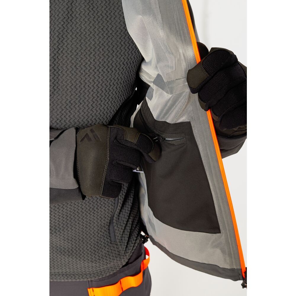 A grey jacket designed for use on construction sites and in industrial work environments.,
