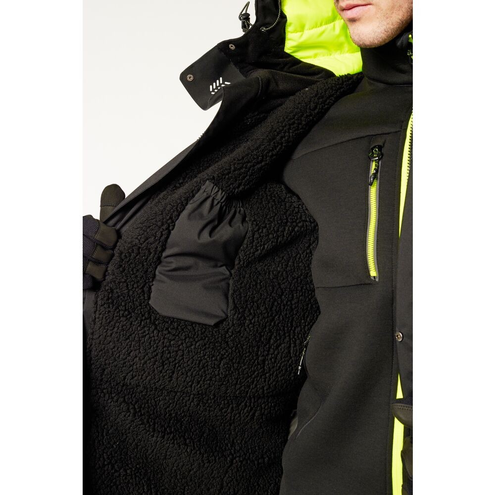 A black jacket designed for use on construction sites and in industrial work environments.,