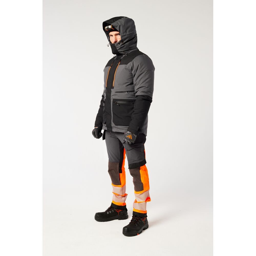 A grey jacket designed for use on construction sites and in industrial work environments.,