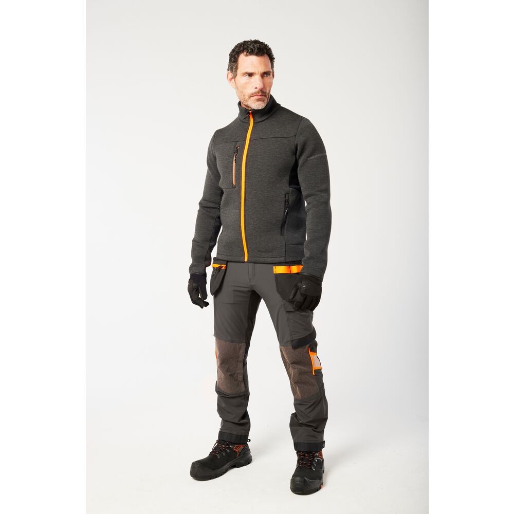 A grey workwear garment designed for use on construction sites and in industrial work environments.,