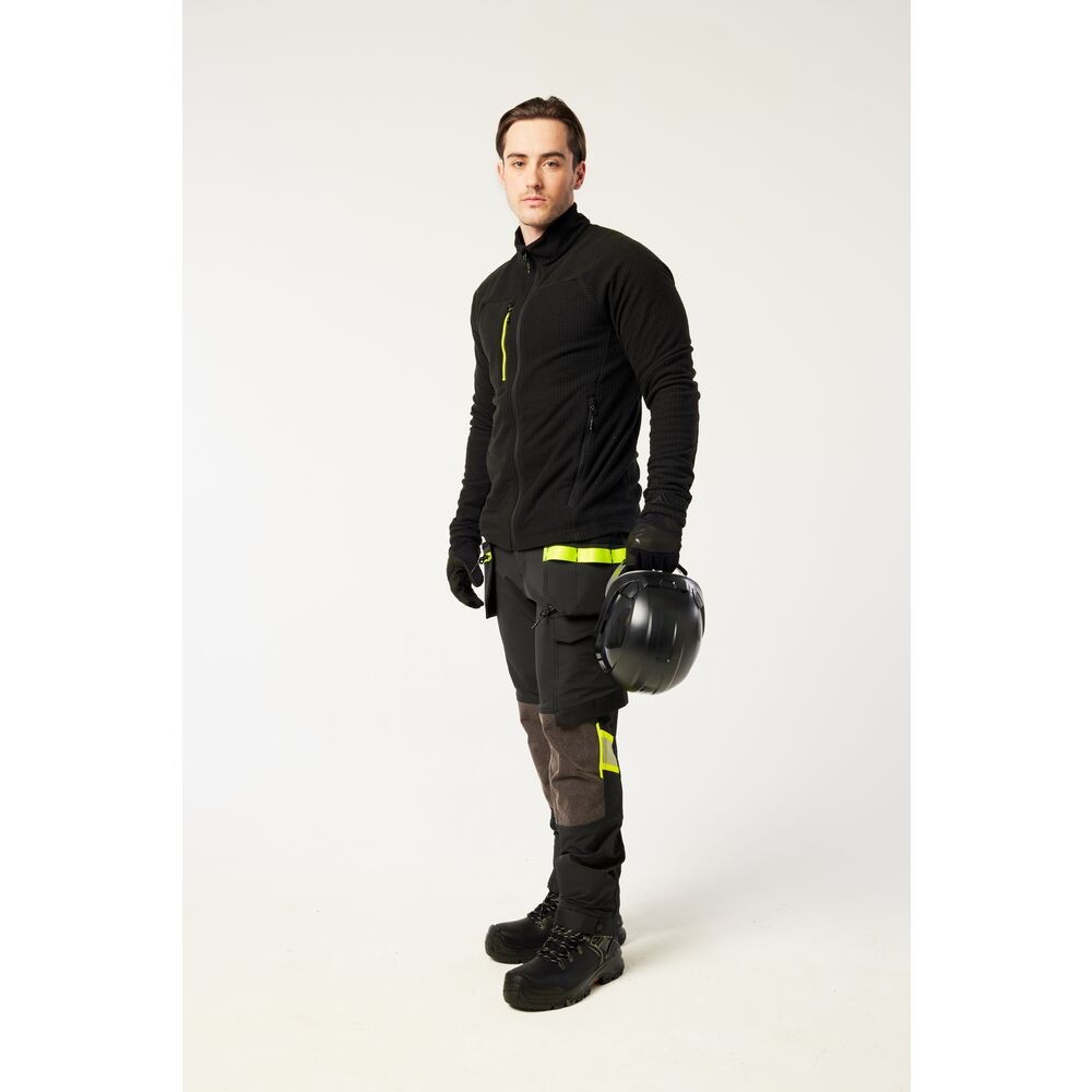 A black workwear garment designed for use on construction sites and in industrial work environments.,