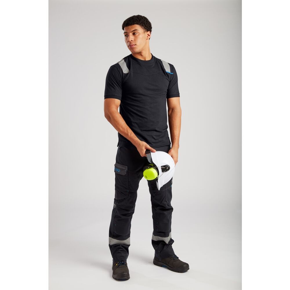A black work shirt featuring flame-resistant fabric, suitable for a wide range of outdoor and site work applications.