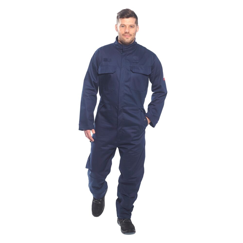 A navy blue coverall featuring flame-resistant fabric, suitable for a wide range of outdoor and site work applications.