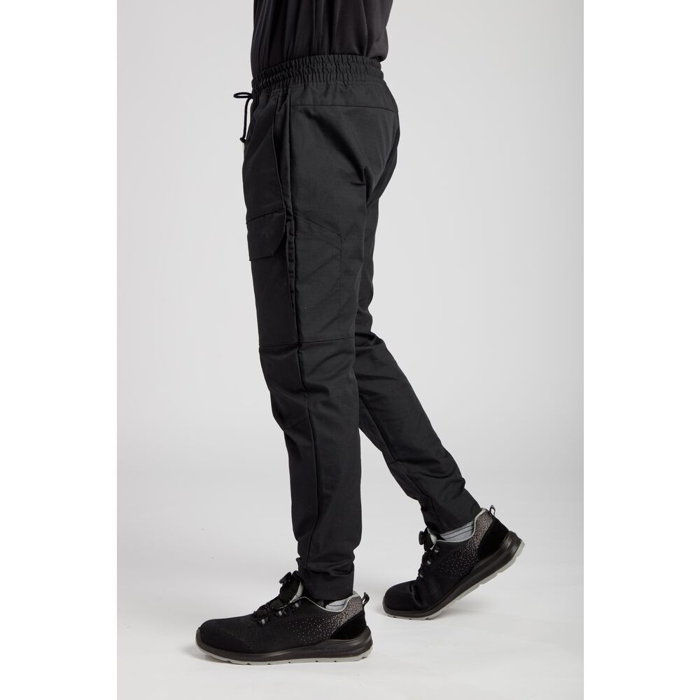 A pair of black work trousers designed for use on construction sites and in industrial work environments.,