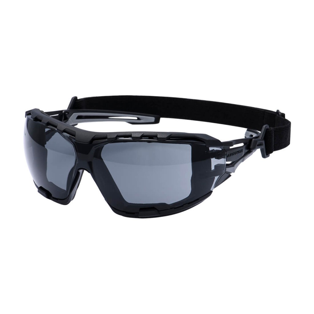 A pair of safety spectacles with clear impact-resistant lenses and adjustable side arms, for eye protection during site work.