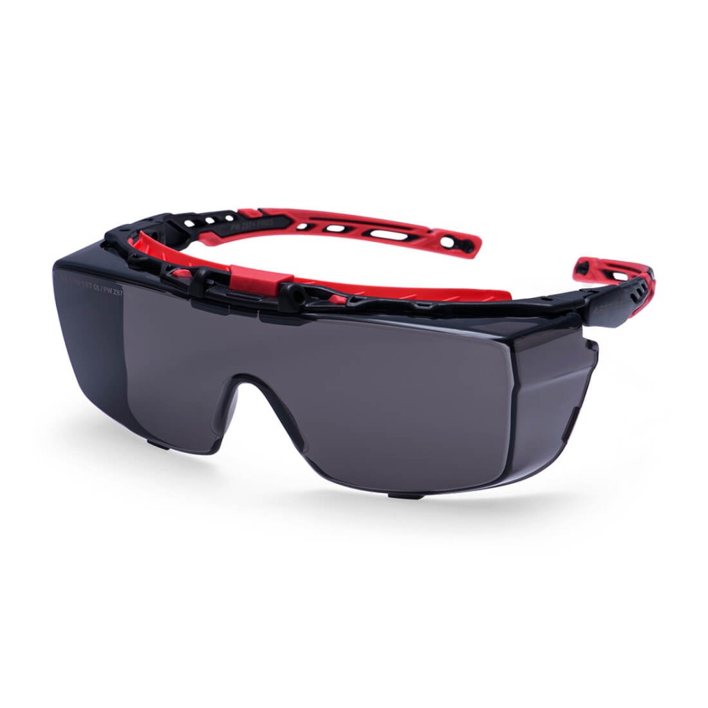 A pair of safety spectacles with clear impact-resistant lenses and adjustable side arms, for eye protection during site work.