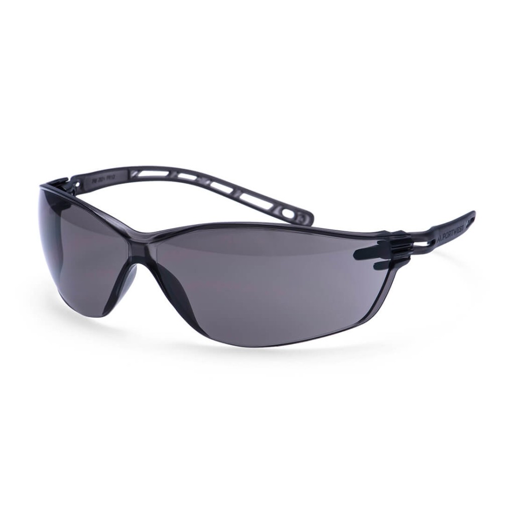 A pair of safety spectacles with clear impact-resistant lenses and adjustable side arms, for eye protection during site work.