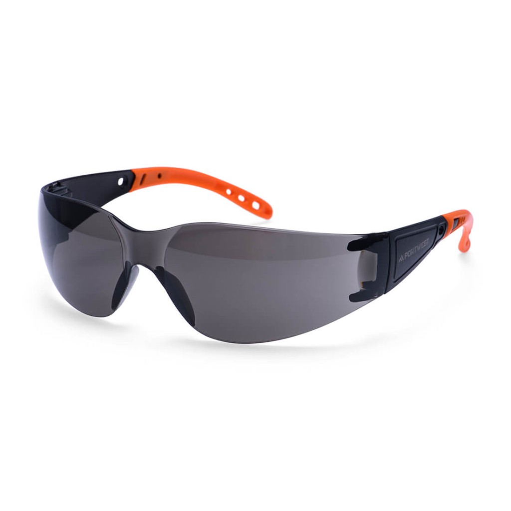 A pair of safety spectacles with clear impact-resistant lenses and adjustable side arms, for eye protection during site work.