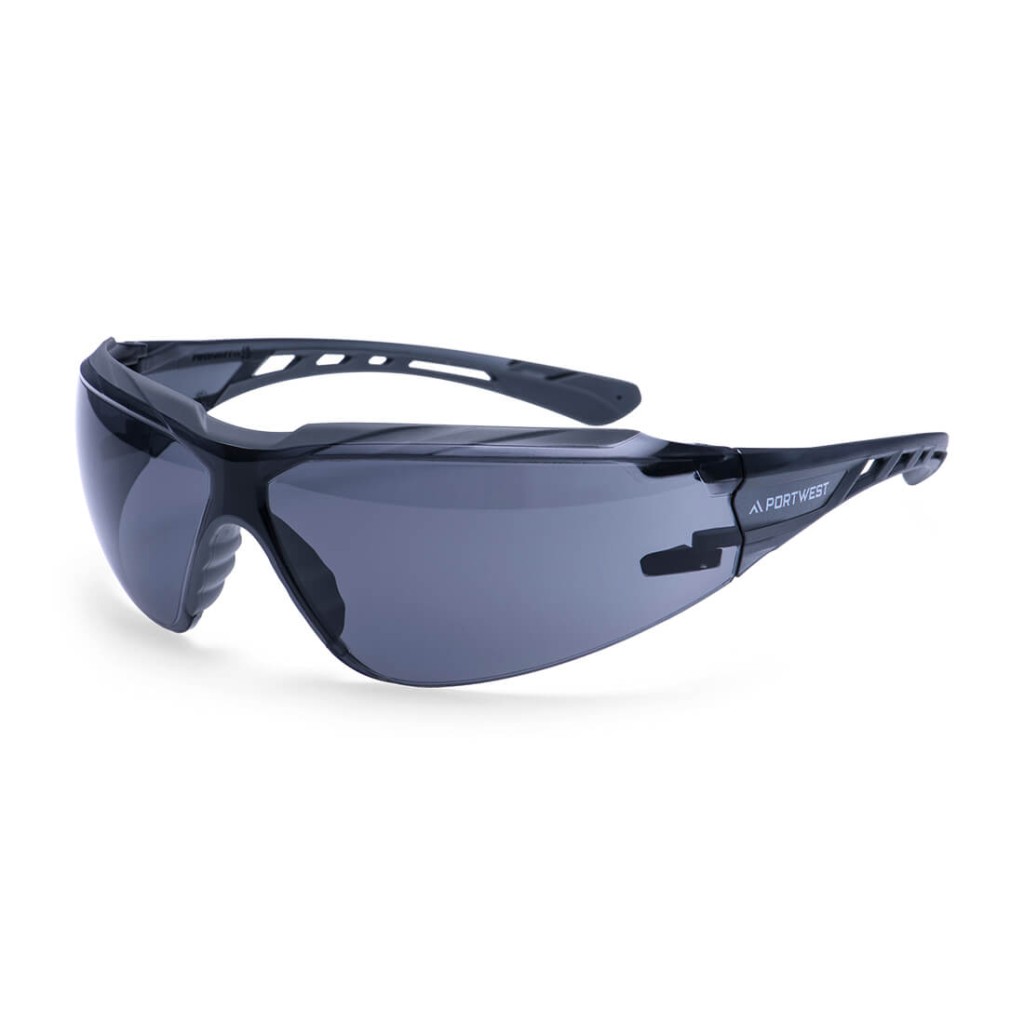 A pair of safety spectacles with clear impact-resistant lenses and adjustable side arms, for eye protection during site work.